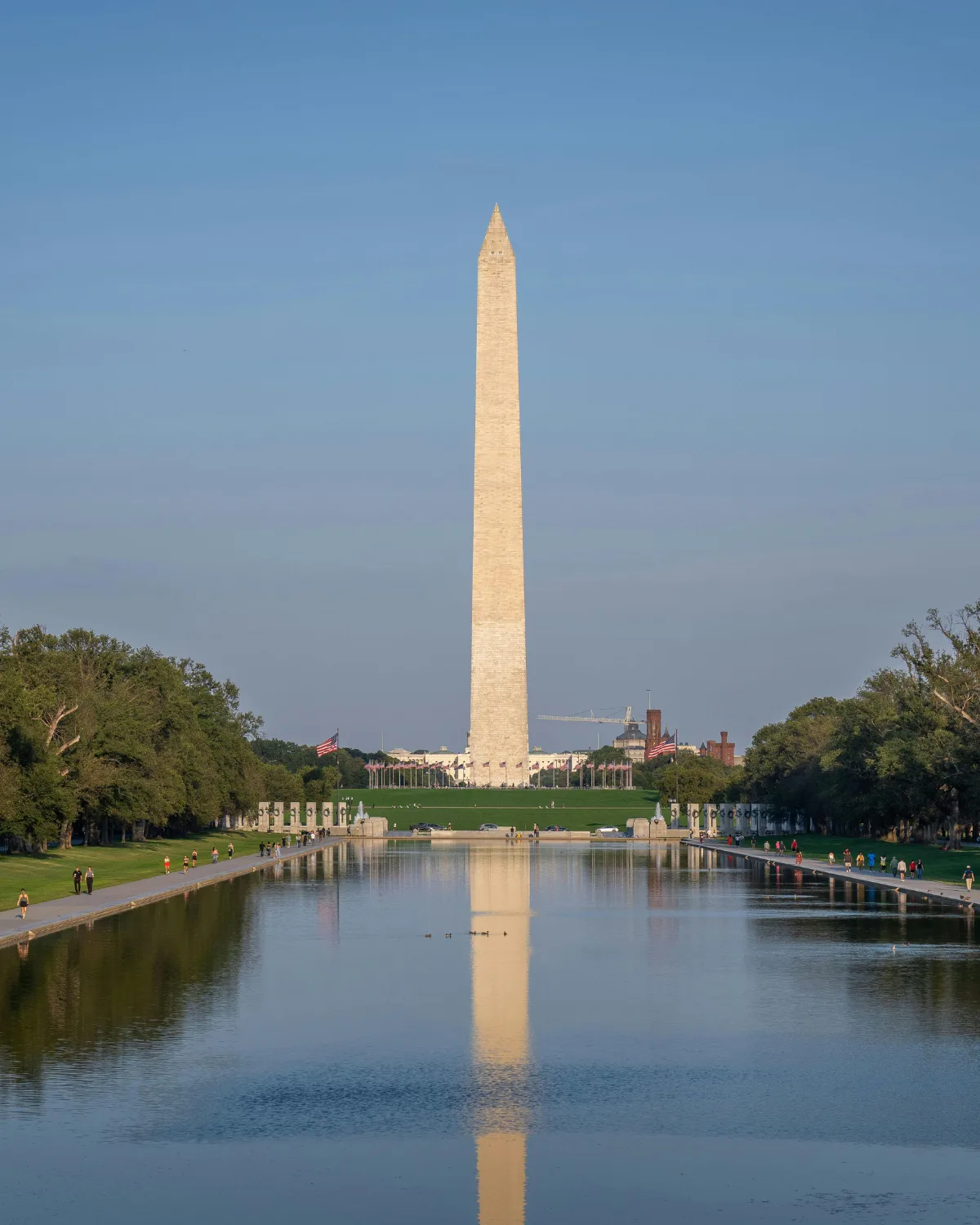 The Washington Monument reflected in the Lincoln Memorial Reflecting Pool on a clear summer day
