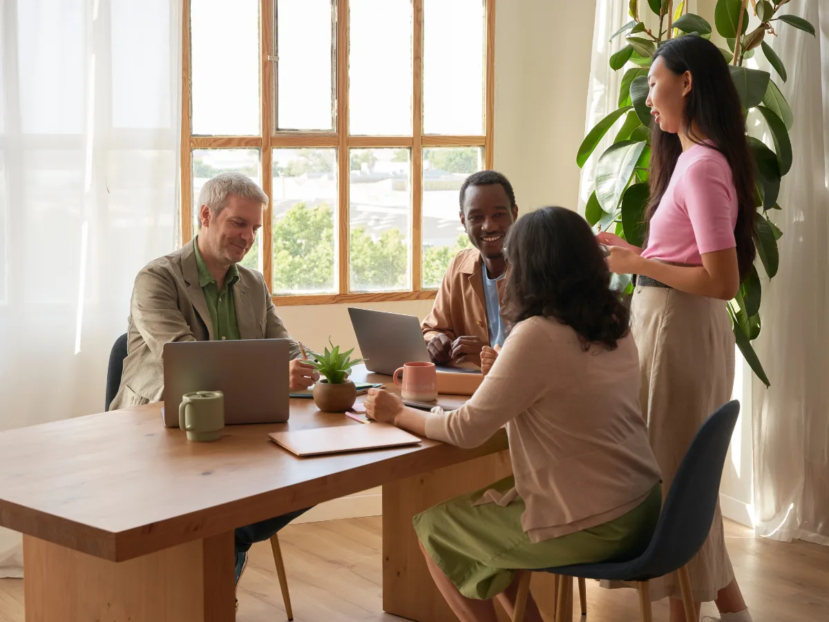 FCPC agents of different generations working together around a table, carrying forward a legacy of mentorship