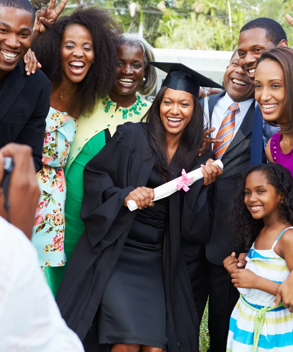 A family celebrating a graduation, representing the milestone moments that IUL cash value can help fund
