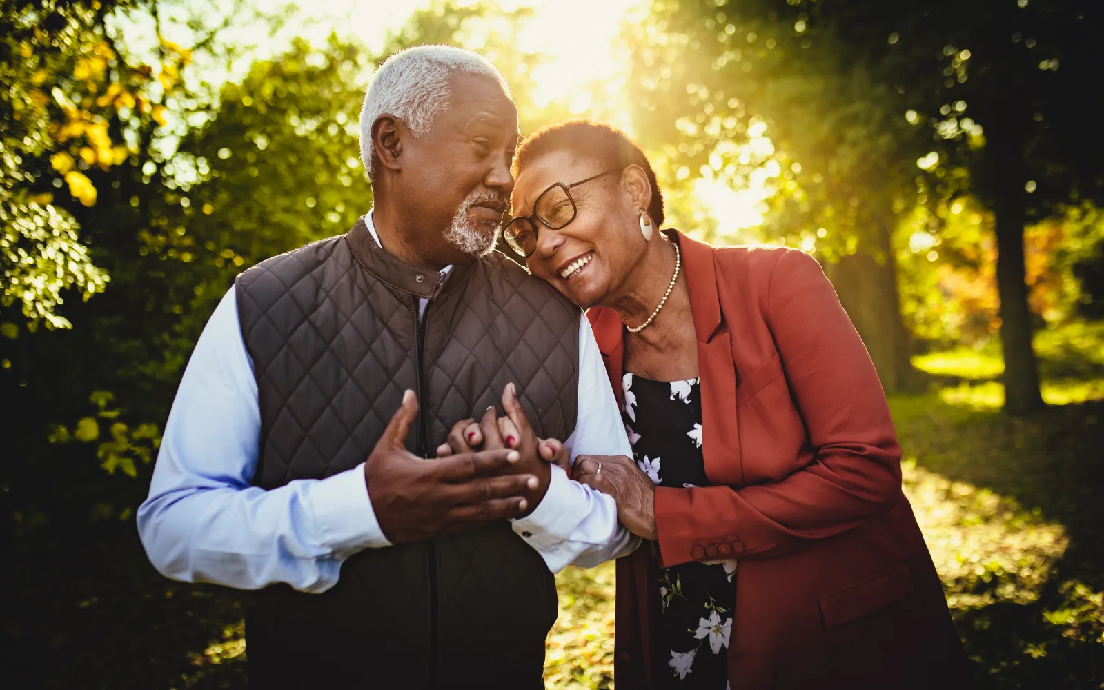 An older couple sitting together peacefully at home, representing final expense planning that protects loved ones from end-of-life costs